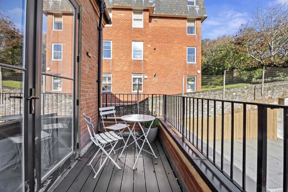 A table and chairs on a balcony