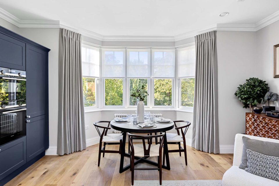 A dining area in front of windows