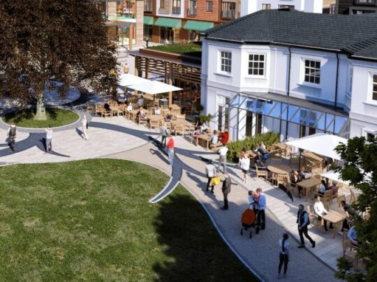 A building with people sitting in a patio area