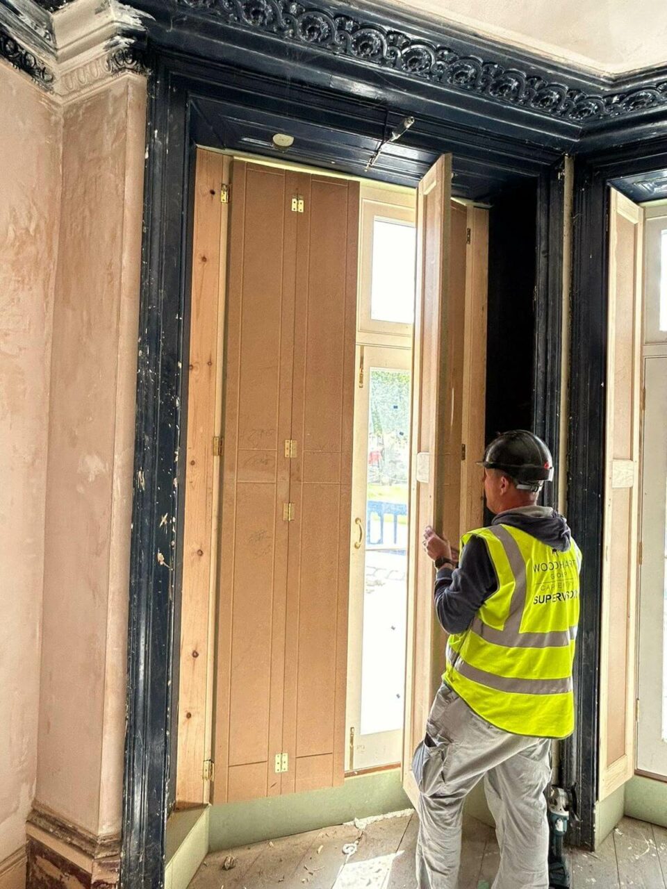 A construction worker and doorway