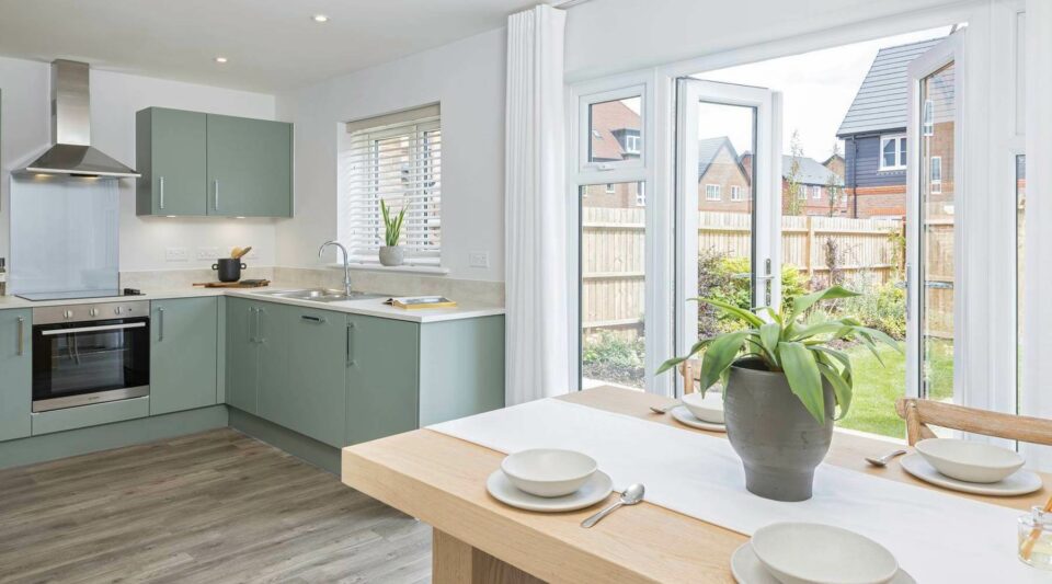 A dining table and kitchen area