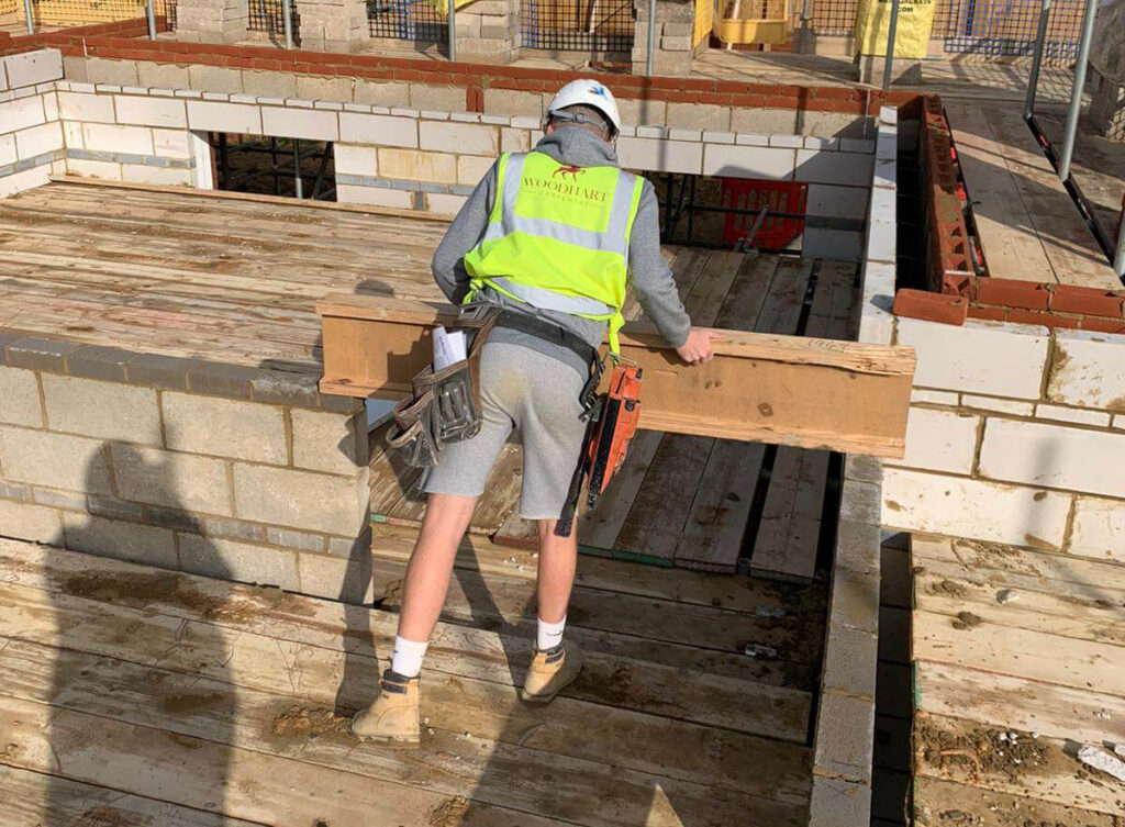 A Woodhart employee working at a construction site